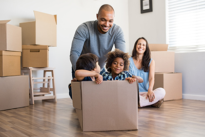 family unpacking boxes